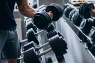 Tricep workout using dumbbells. (Image credits: Freepik)